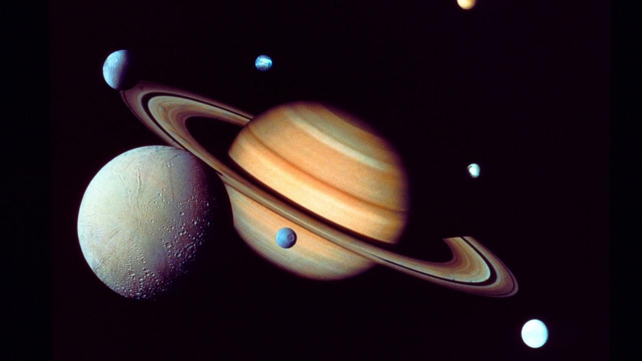 A Growing Cosmic Family  In an extraordinary astronomical breakthrough, Saturn has just expanded its cosmic family by 128 newly identified moons, soli