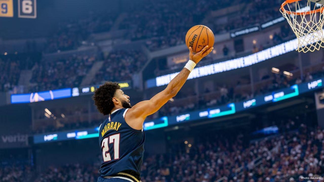 Warriors Triumph Over Nuggets in Overtime as Curry Shines with 42 Points