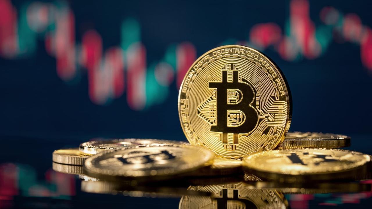 Bitcoin Retreats Below $70,000 as Crypto Markets Face Turmoil