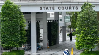 Singapore Charges Scam Syndicate Member